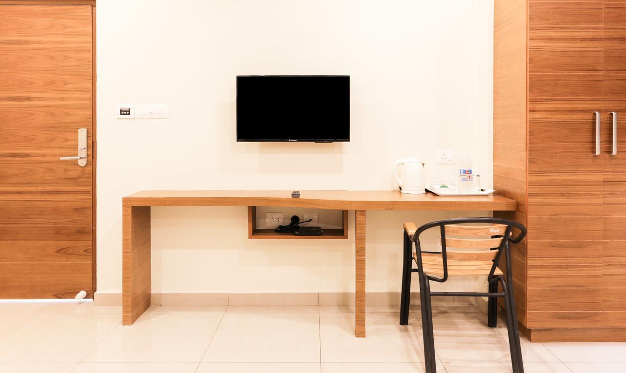 Treebo Trend Cmks Gulmohar Suites Kochi Esterno foto